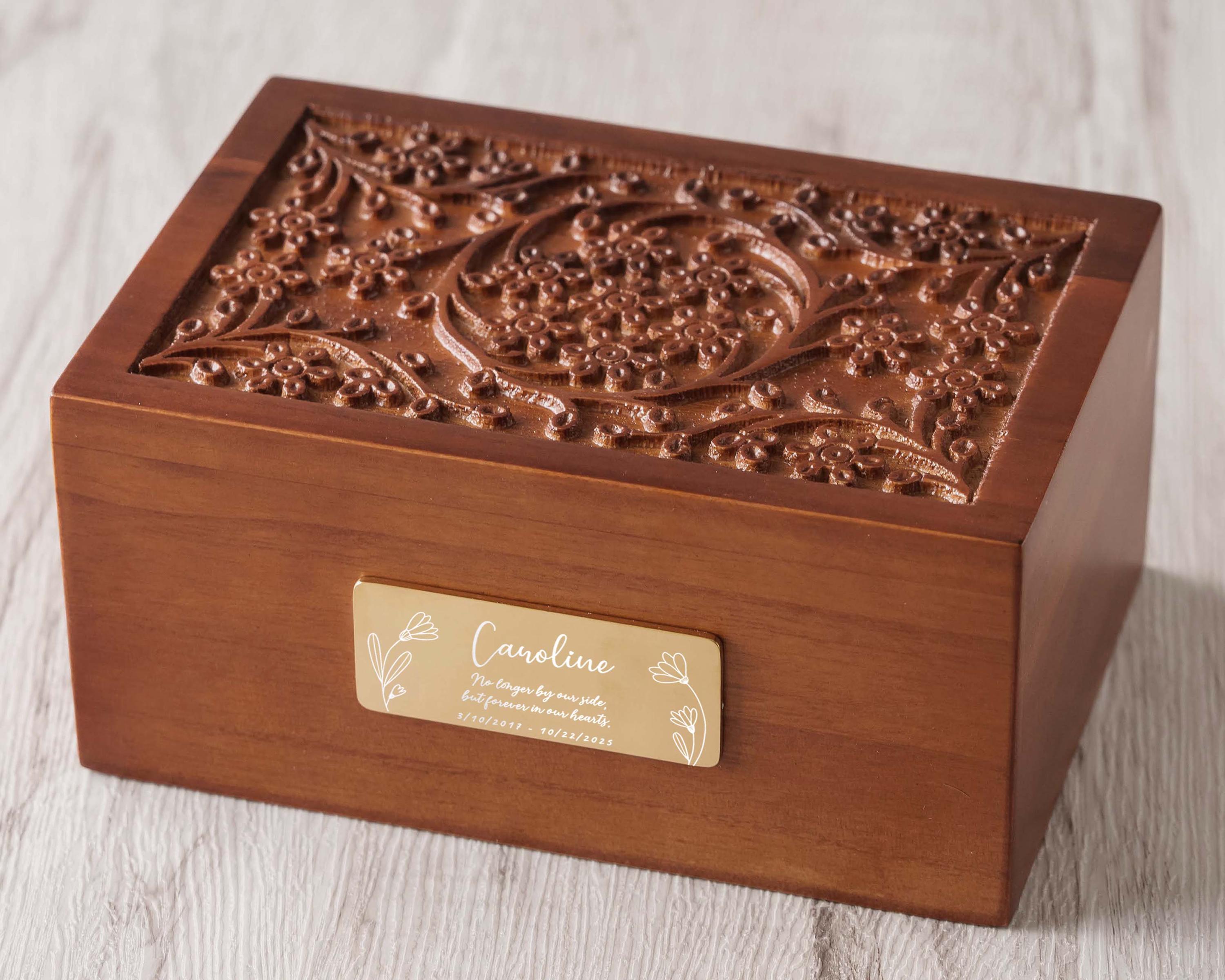 a wooden box with a gold label on it