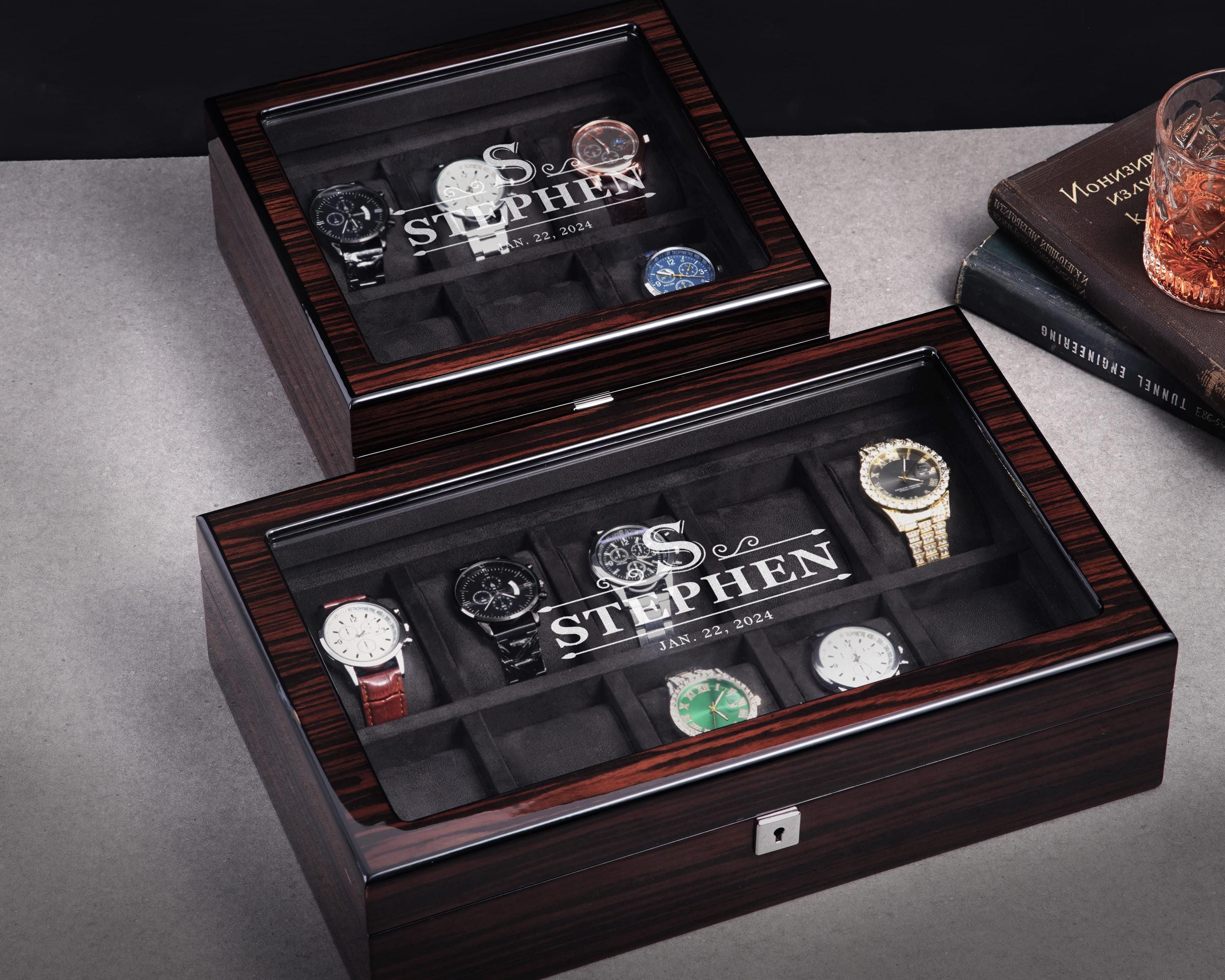 a couple of watches sitting inside of a wooden box