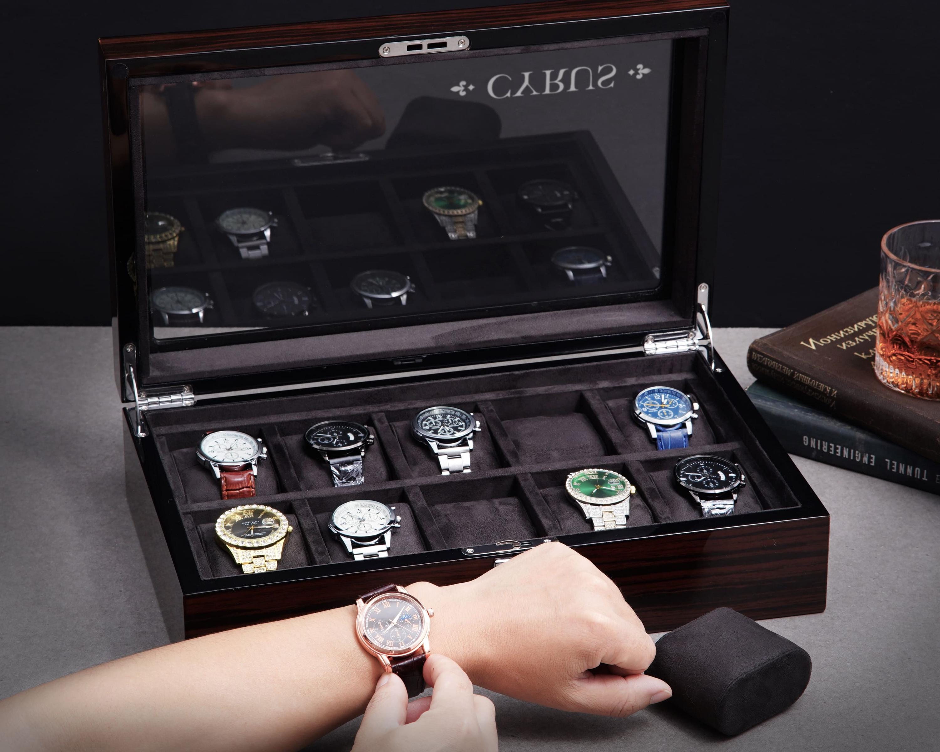 a person holding a watch in a wooden box