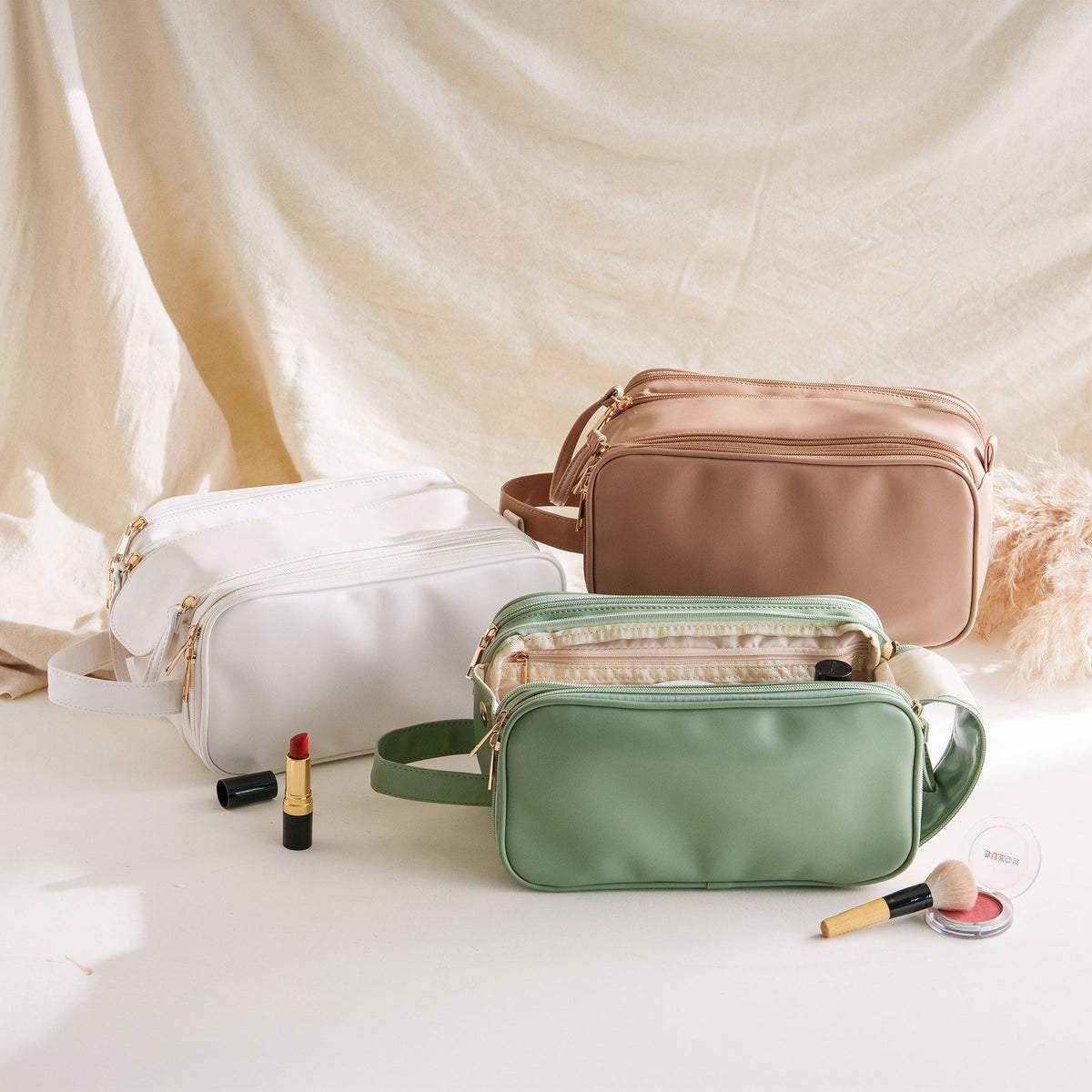 Cosmetic bags with side handle in white, khaki and sage green with makeup