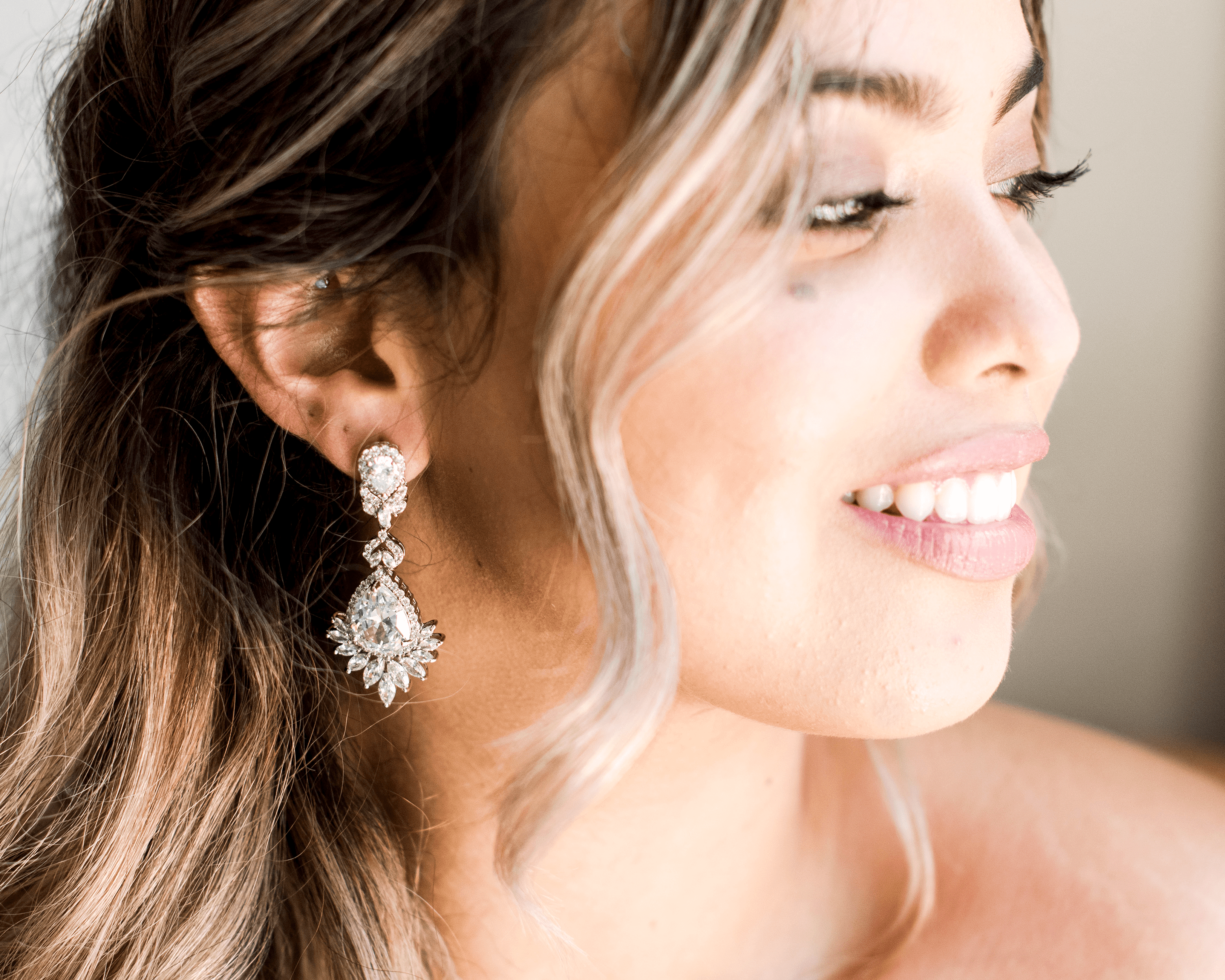 Crystal Chandelier Earrings - A beautiful bride wear Bridal Chandelier Earrings on her wedding day - Hundred Hearts