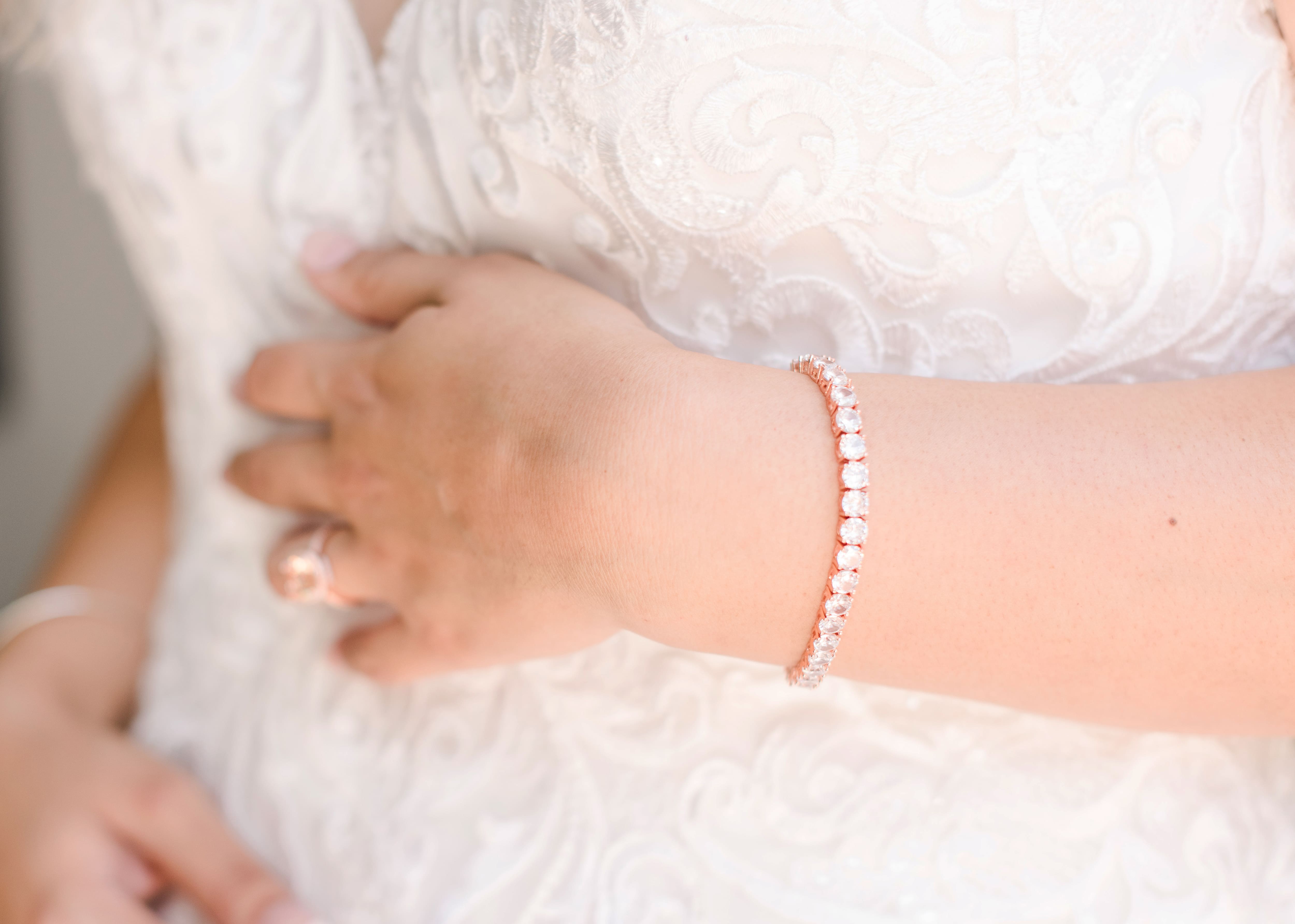The Wedding Tennis Bracelet displayed from different angles, showcasing its exquisite design and dazzling diamonds.