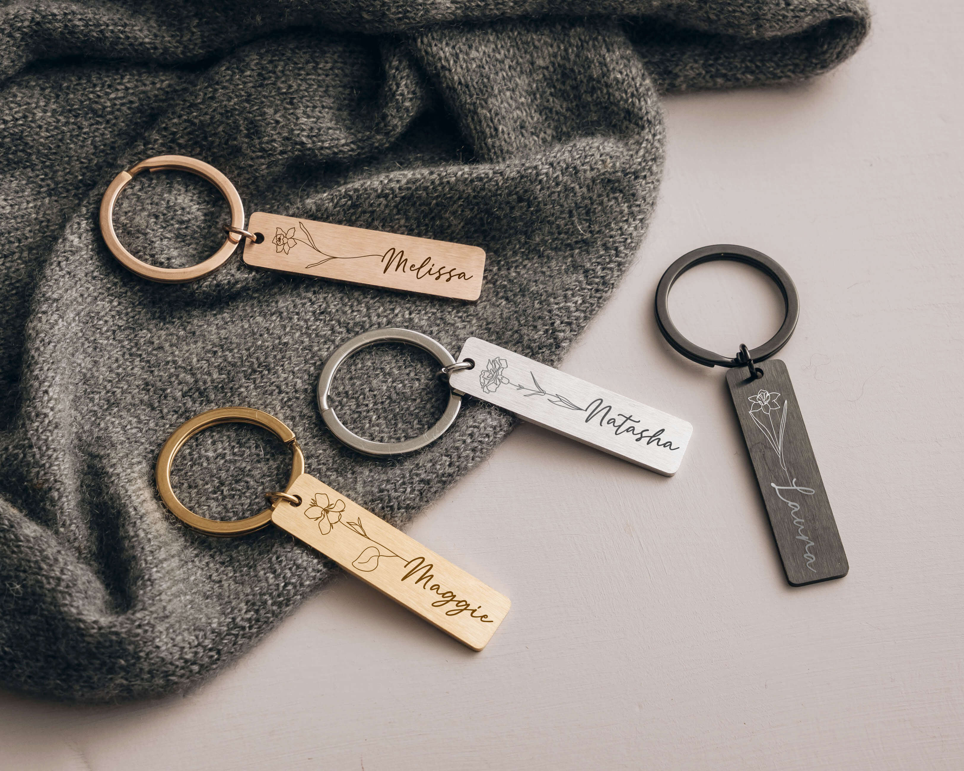 Rosegold, Gold, Black and Silver Personalized Keychains with birth flower image and name.