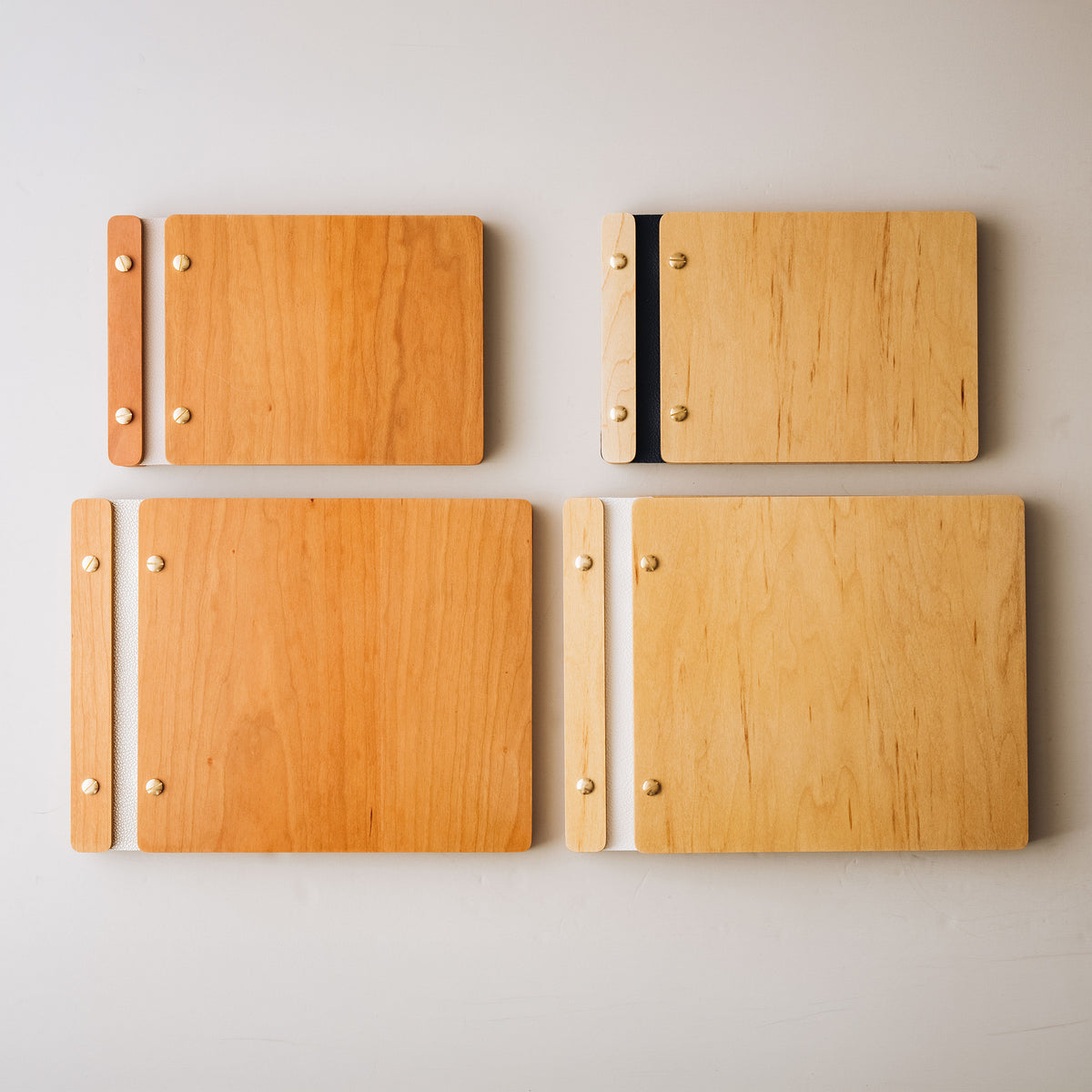 Maple and cherry wood guest book covers in two sizes with leather spines
