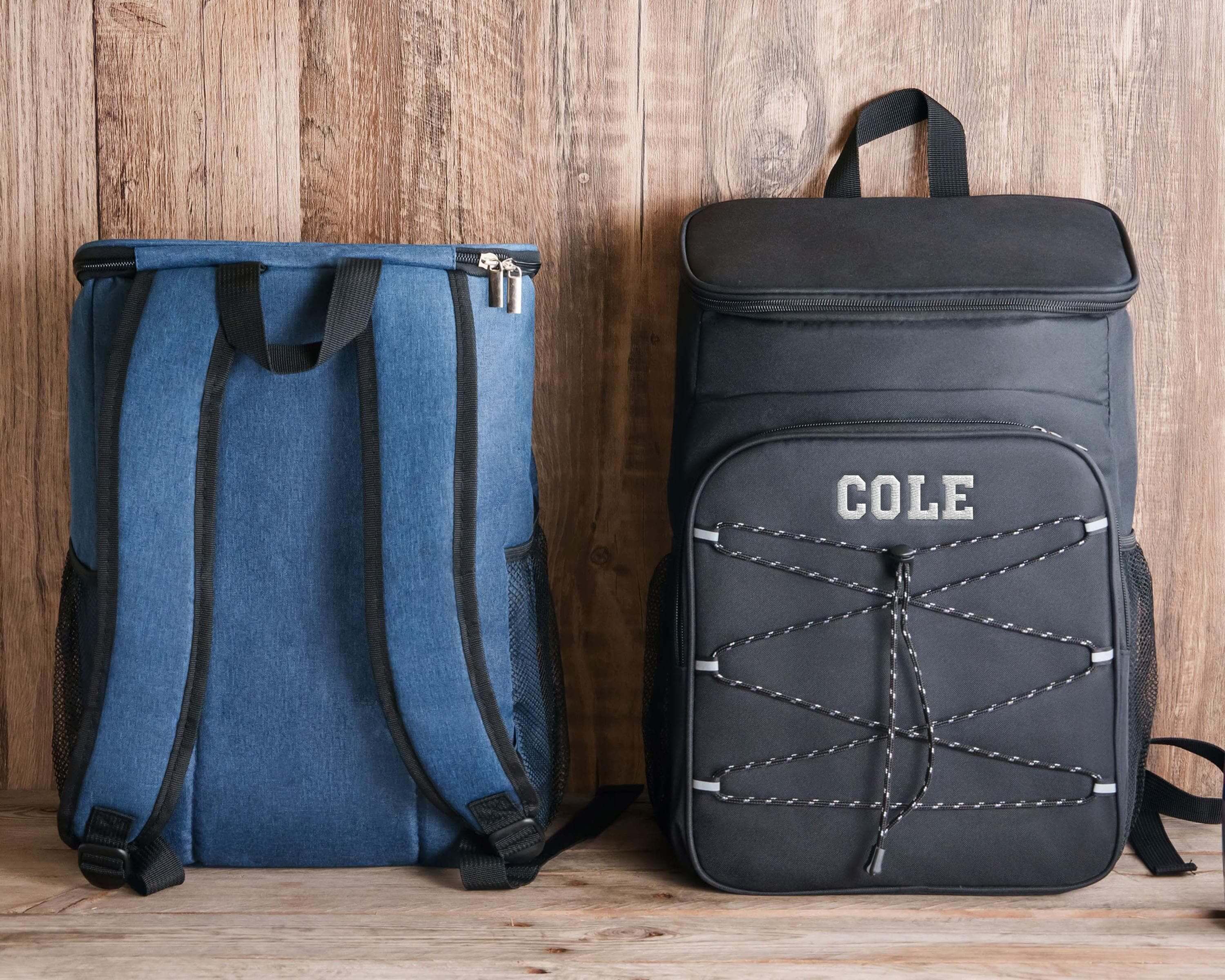 two backpacks sitting next to each other on a wooden floor