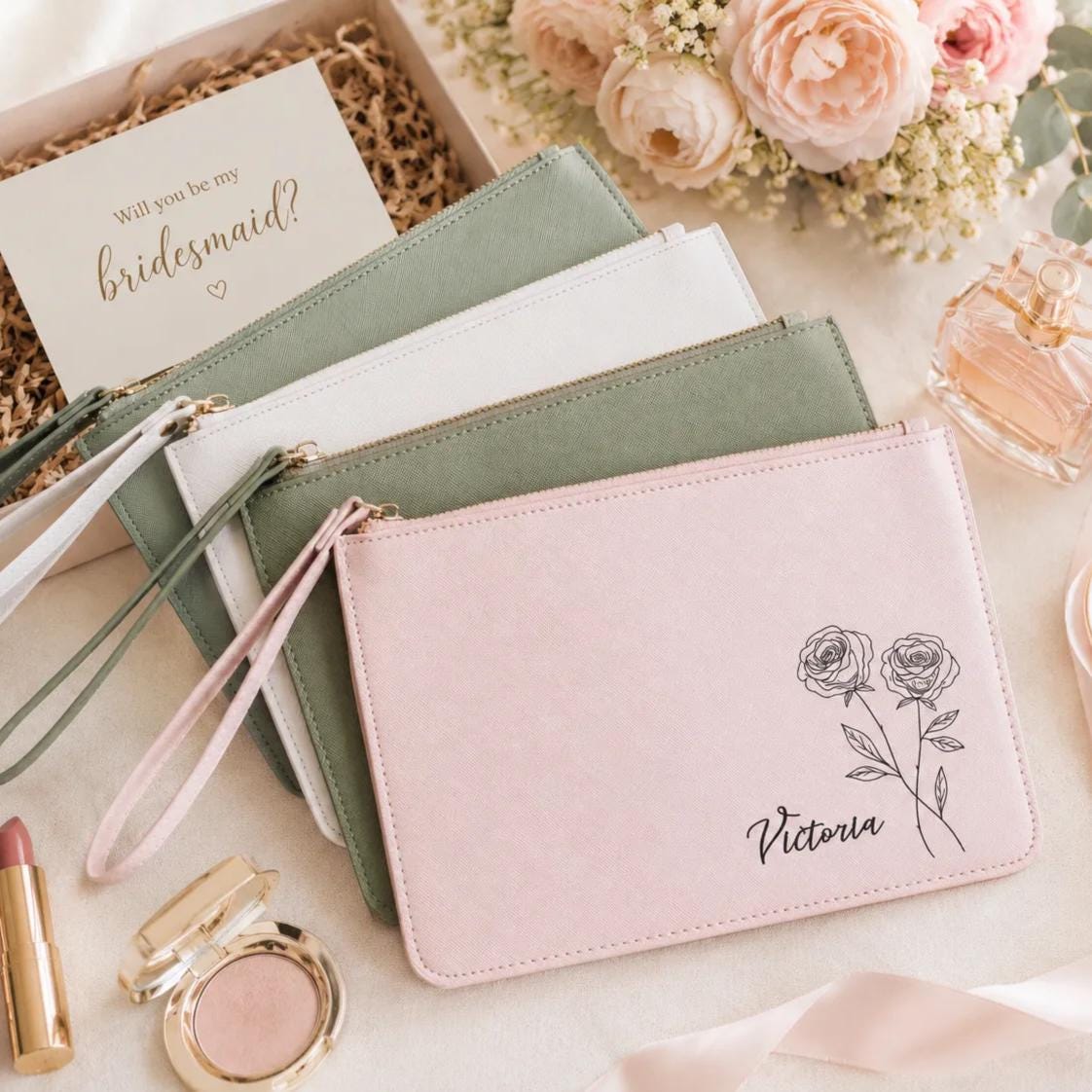 Personalized clutch bags in sage and blush with name and birth flower engraving