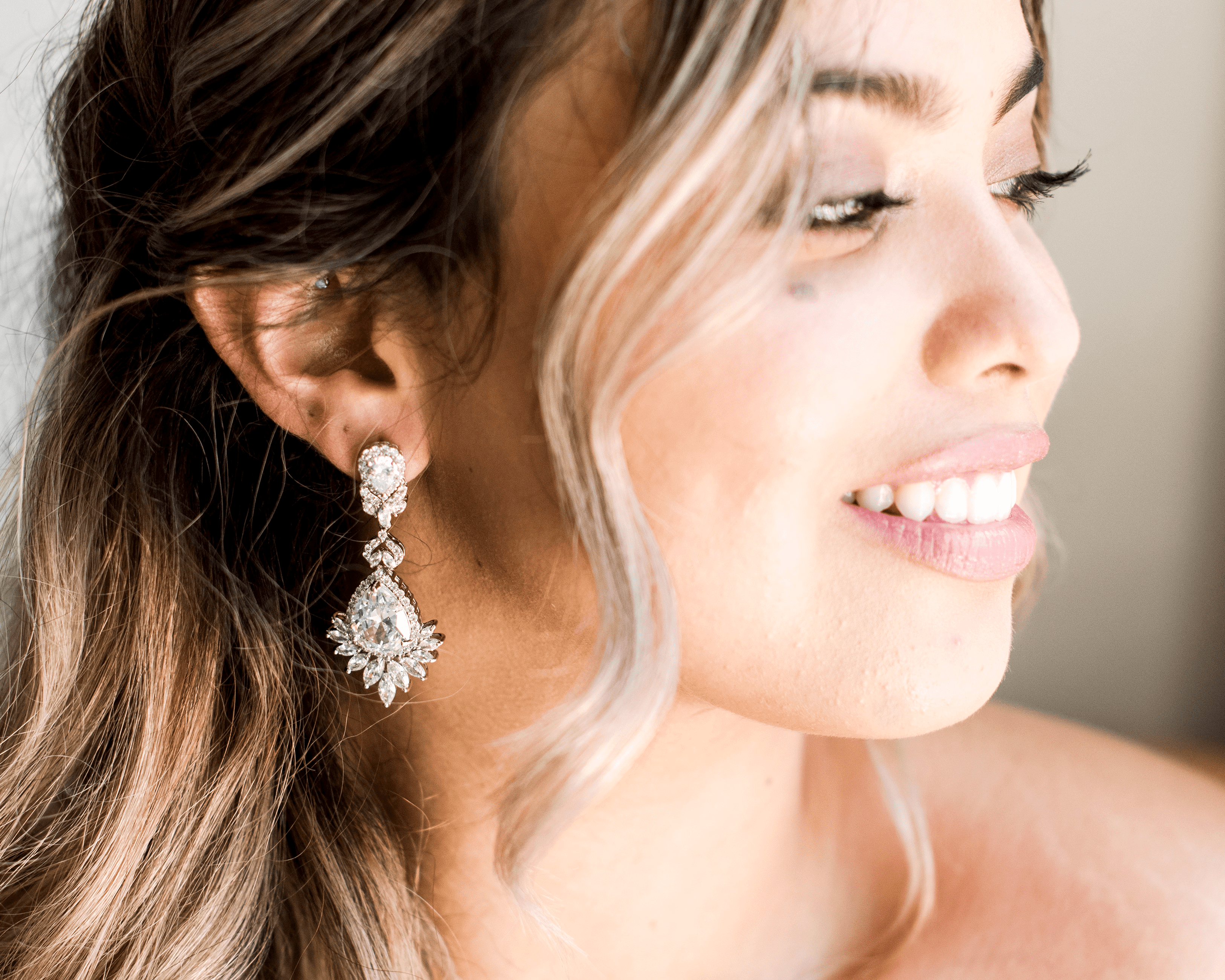 Crystal Chandelier Earrings - A beautiful bride wear Bridal Chandelier Earrings on her wedding day - Hundred Hearts 