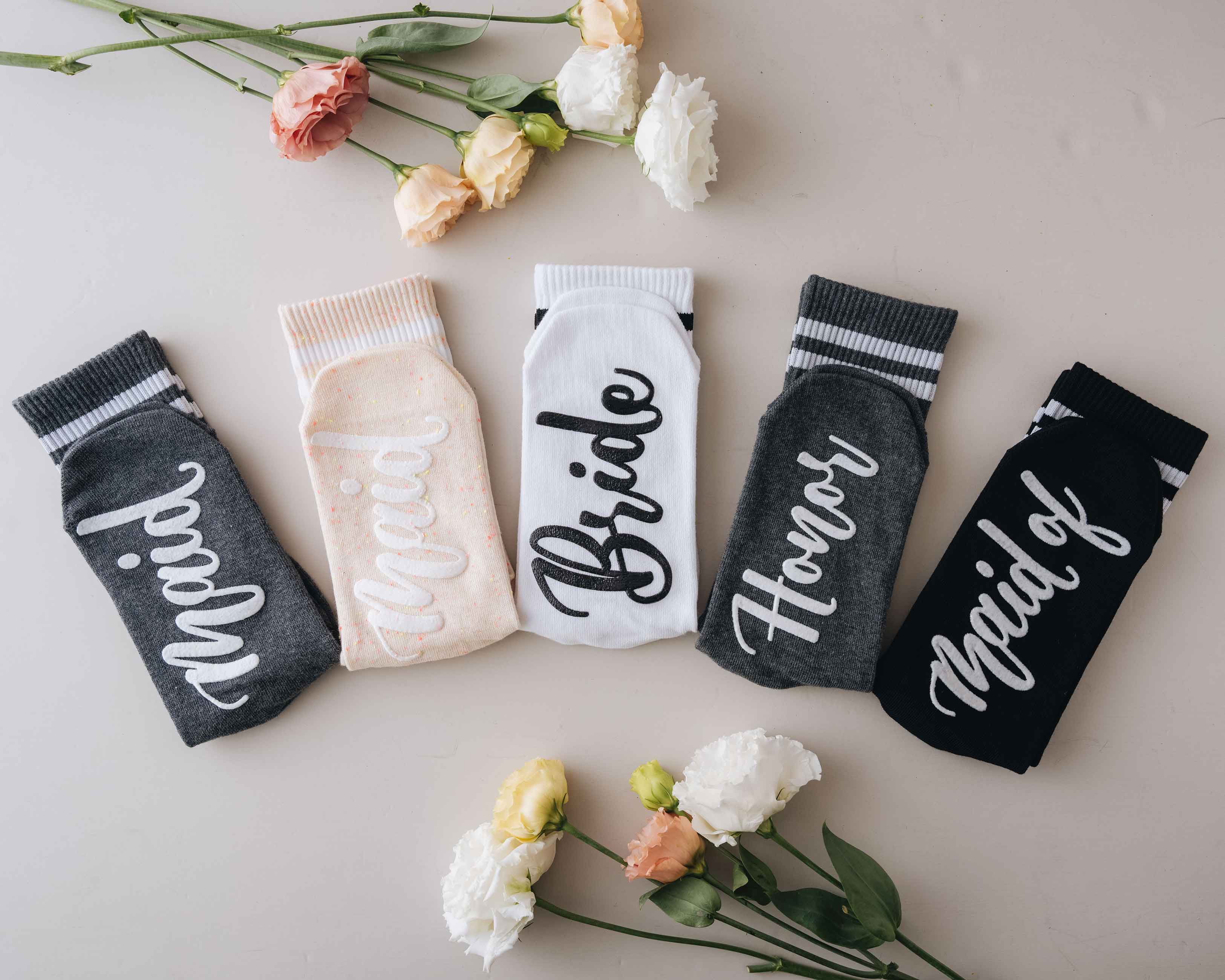 Bridesmaid Socks - Bridesmaid Socks for Bachelorette Party provide 4 different sock color and 4 different custom text displayed on the bottom of bridesmaid socks - "The Bride," "Bridesmaid," "Maid of Honor," or "Matron of Honor."