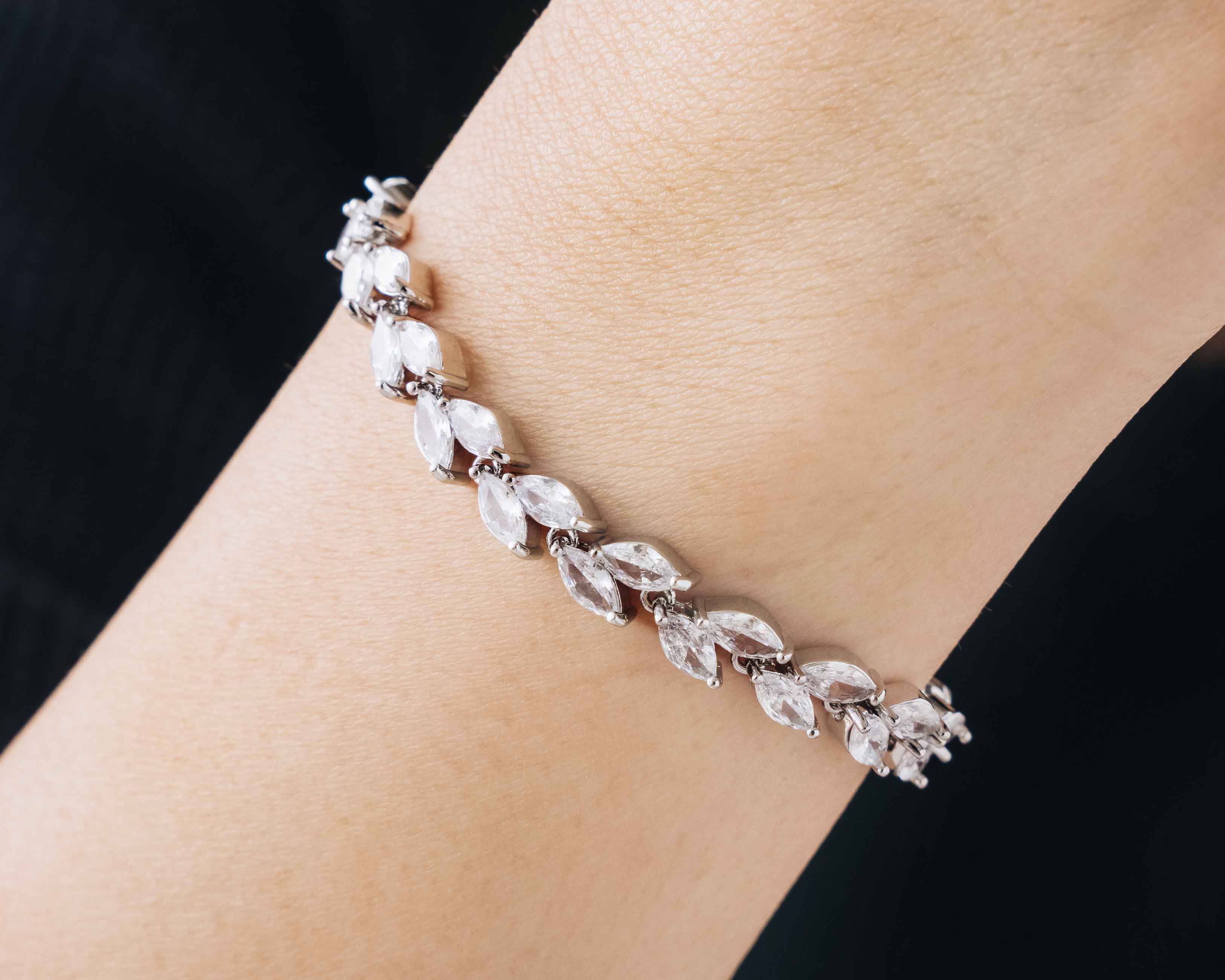 The Bridal Dainty Bracelet displayed from different angles, highlighting its delicate design and charming details.
