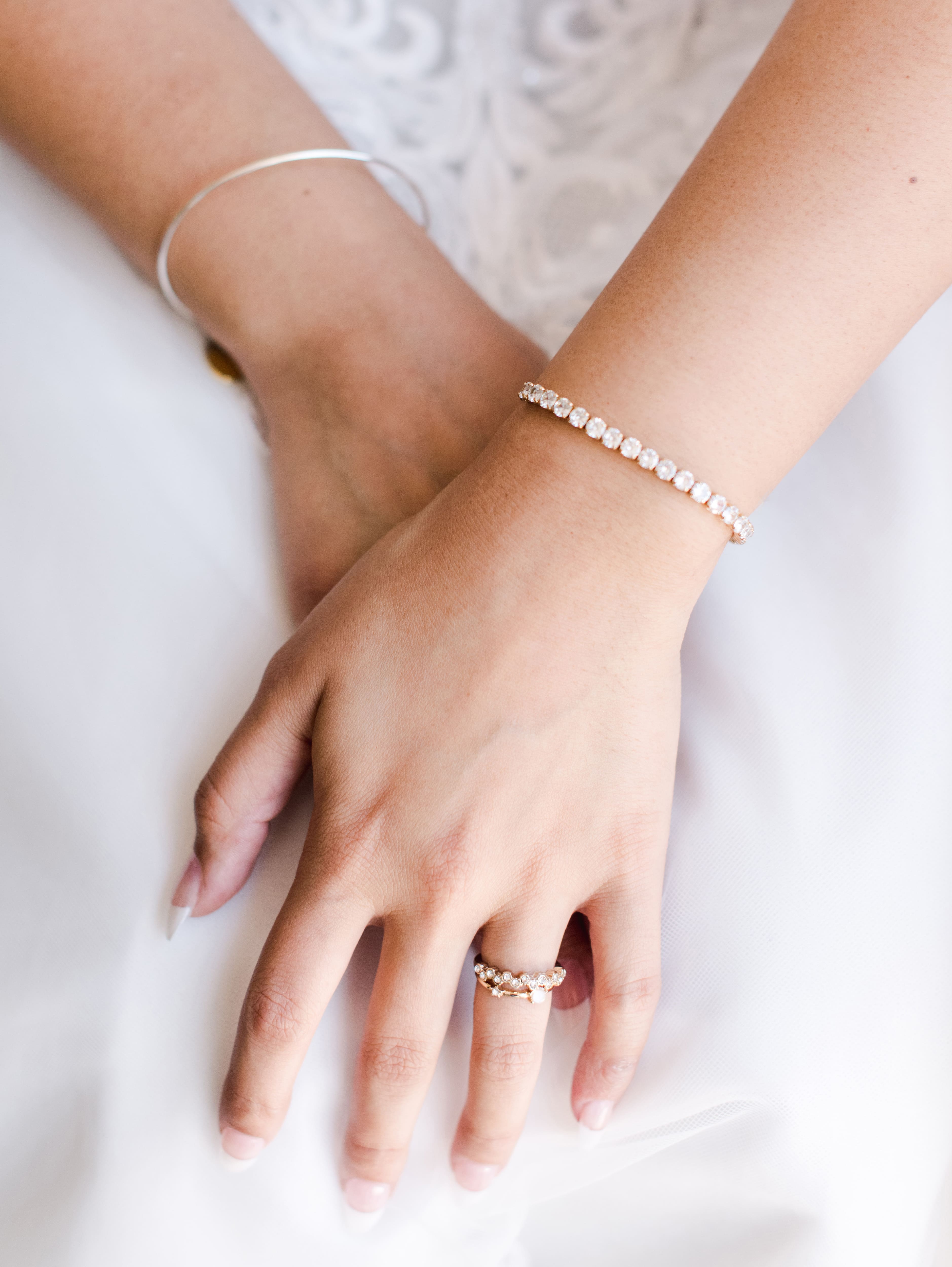 The Wedding Tennis Bracelet displayed from different angles, showcasing its exquisite design and dazzling diamonds.