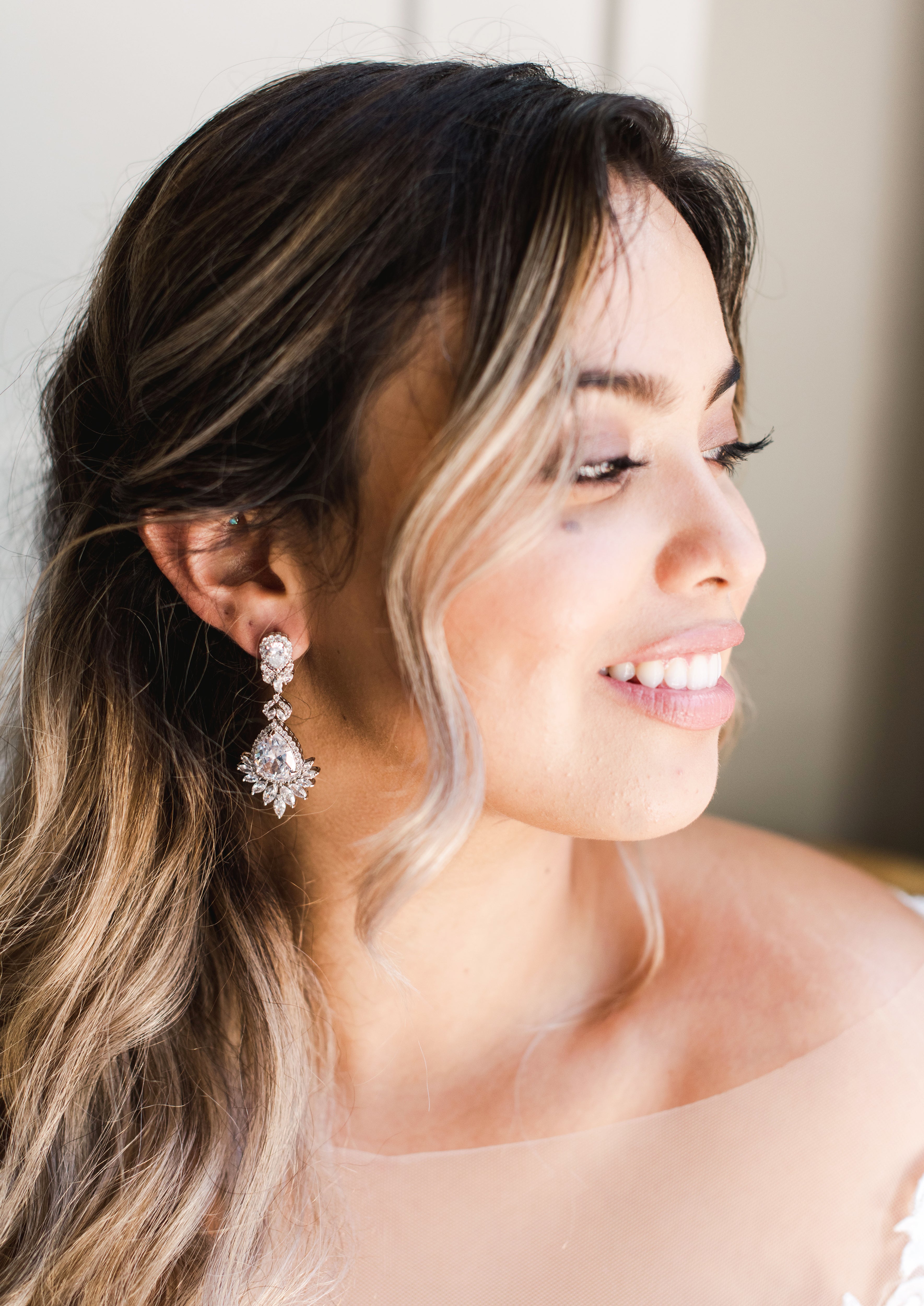 Crystal Chandelier Earrings - A beautiful bride wear Bridal Chandelier Earrings on her wedding day - Hundred Hearts 