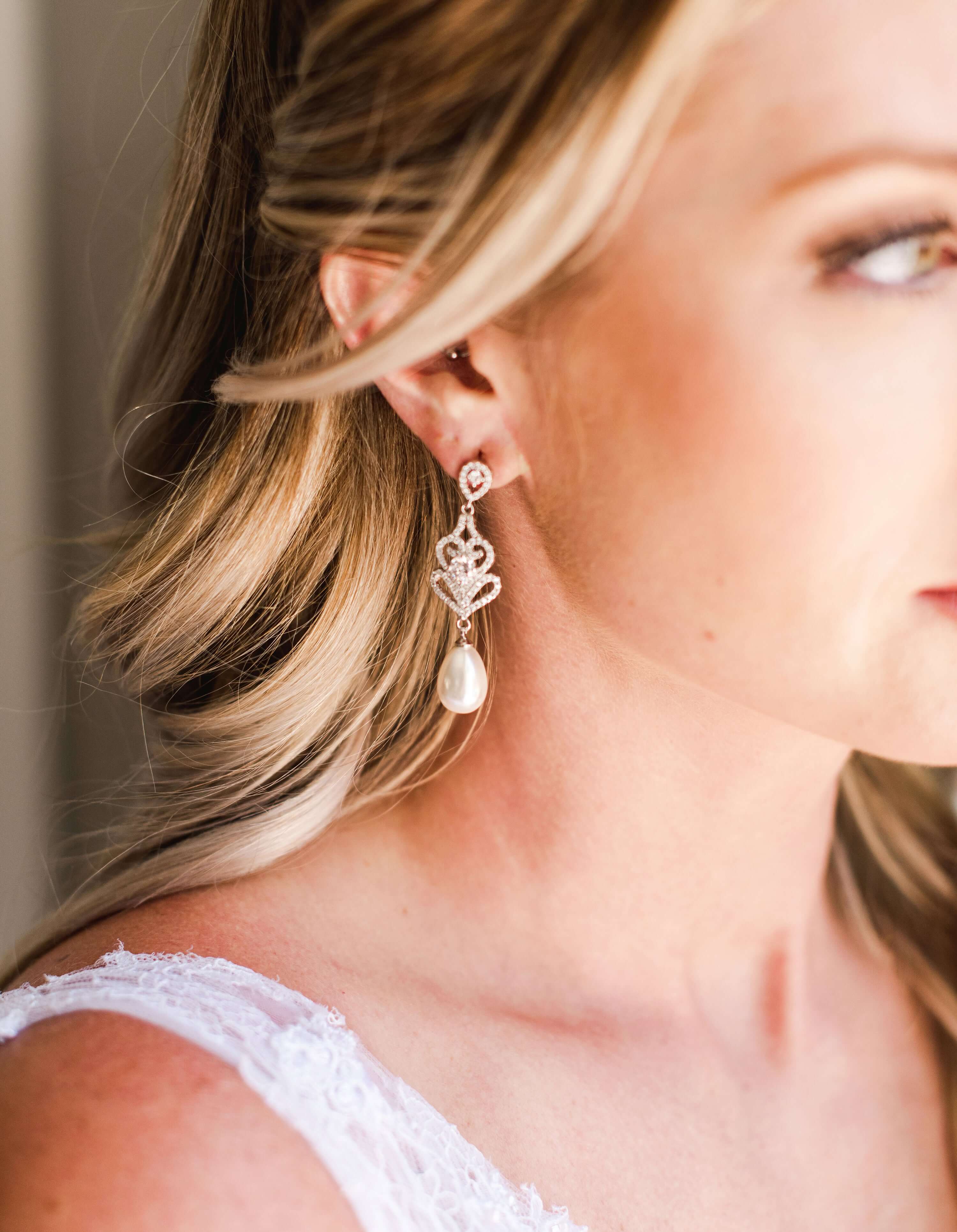 Pearl Drop Earrings - A beautiful bride wear Wedding Pearl Earrings on her wedding day - Hundred Hearts 