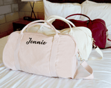 Personalized white, blush and mulberry Duffle Bags with initials.